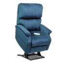 A blue recliner with the cup holder on it.