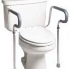 A toilet with two handles and a seat.