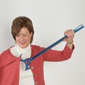 A woman holding a giant pair of scissors.