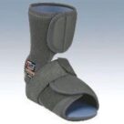 A gray ankle brace with an open heel.