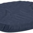 A blue round dog bed with a black cover.