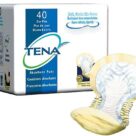 A box of tena pads next to a package.