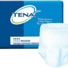 A box of tena diapers next to a pair of panties.